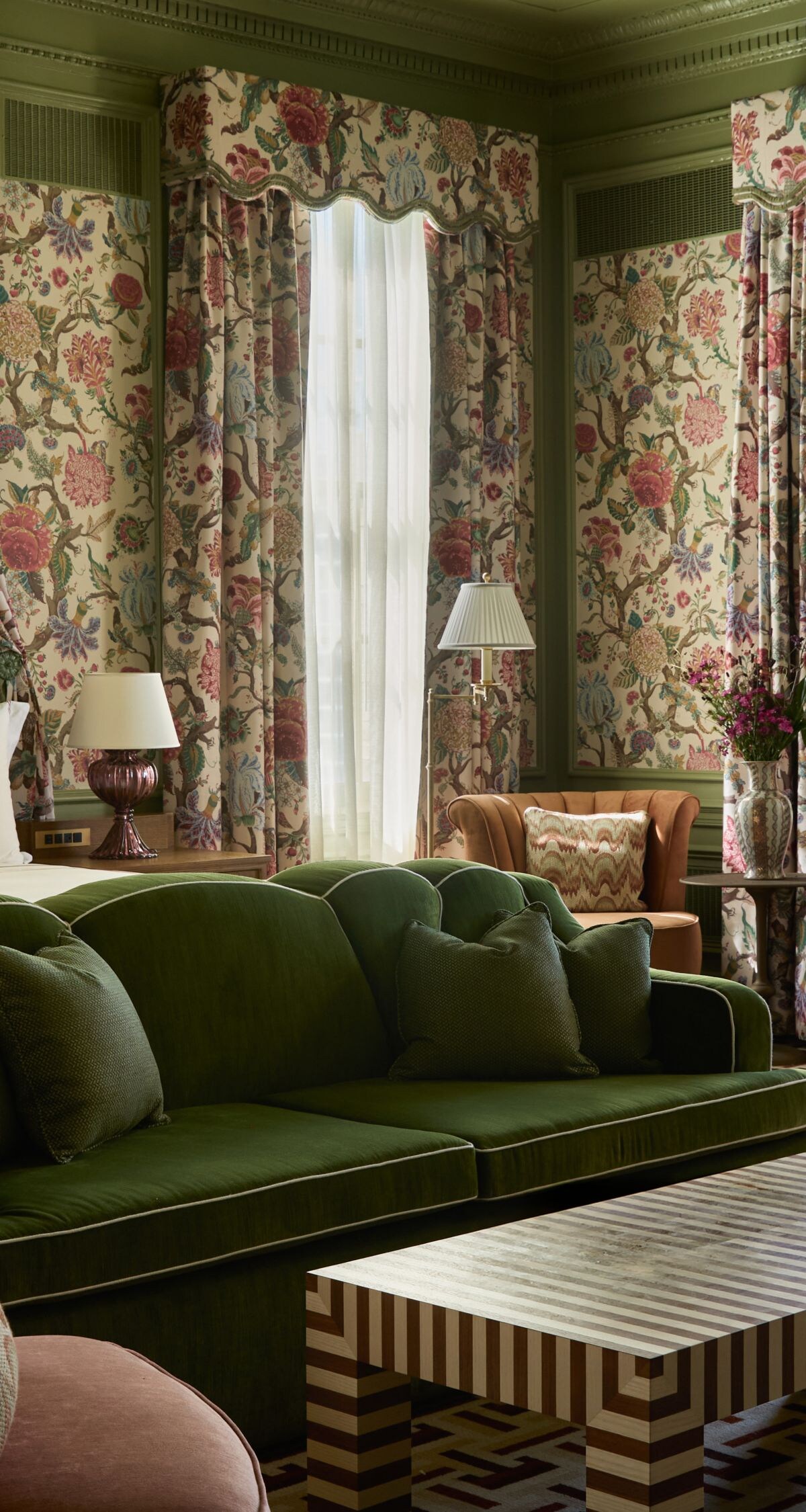 Spacious suite with floral décor and seating area