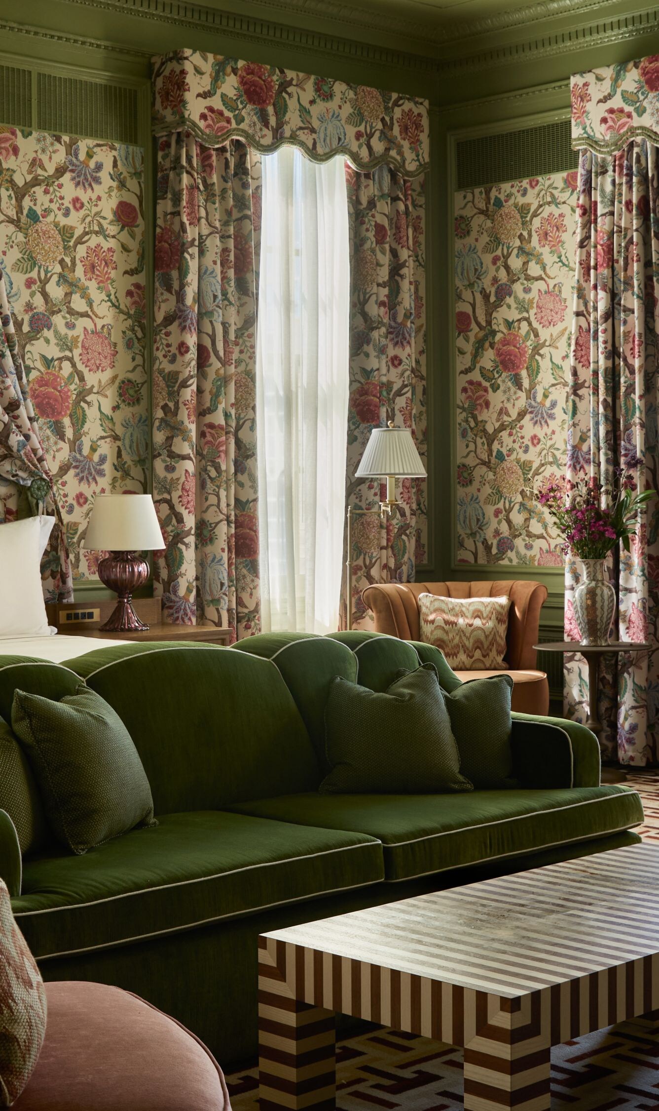 Spacious suite with floral décor and seating area