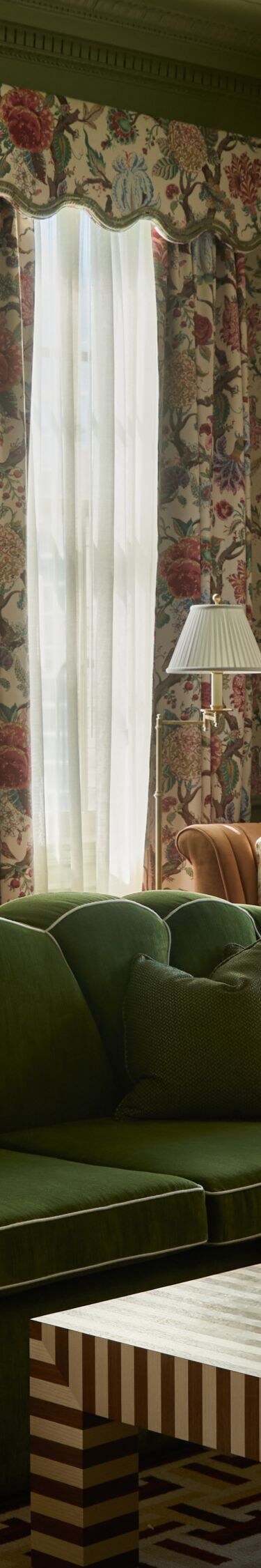 Spacious suite with floral décor and seating area
