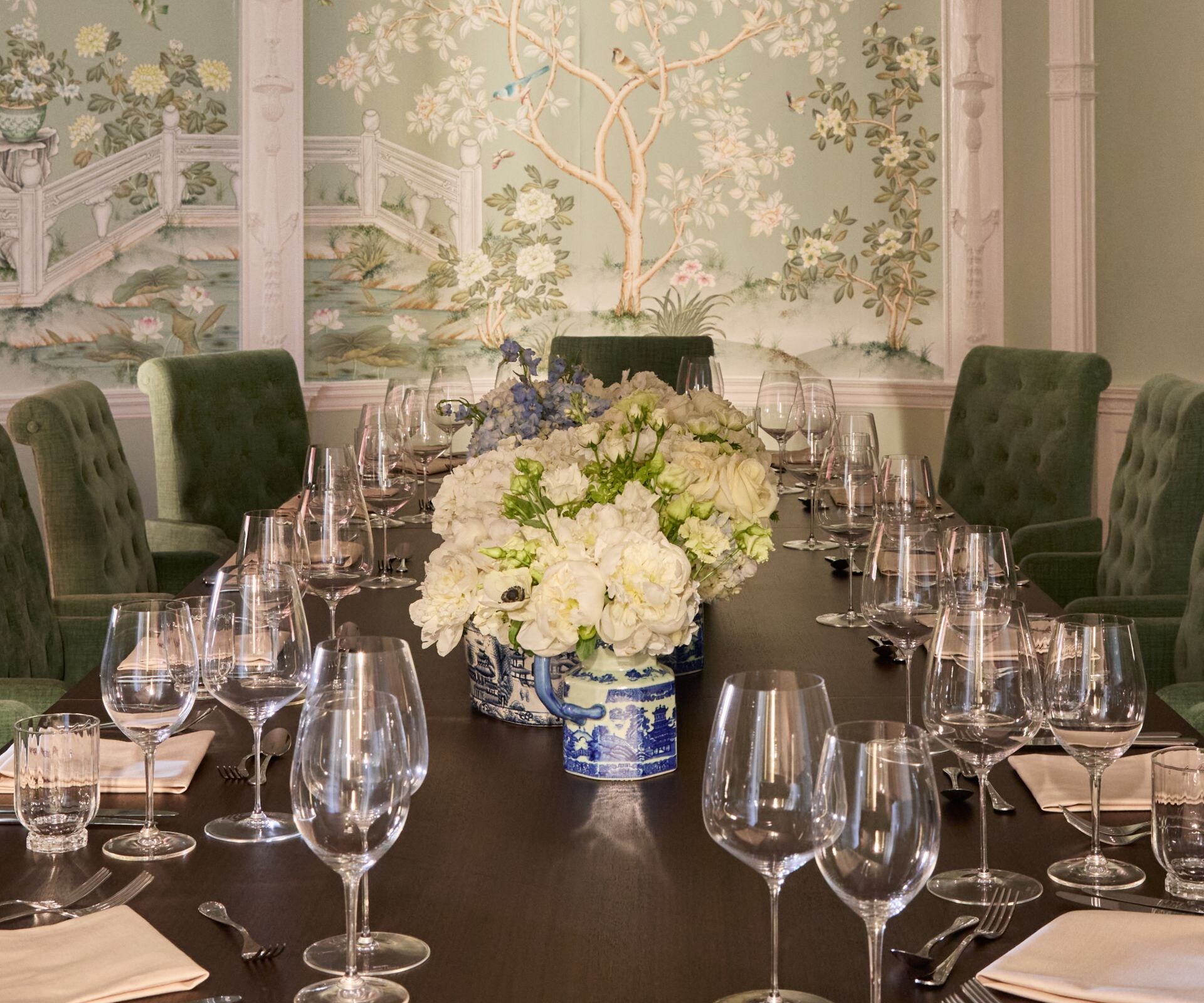 Elegant dining room with mural and flowers