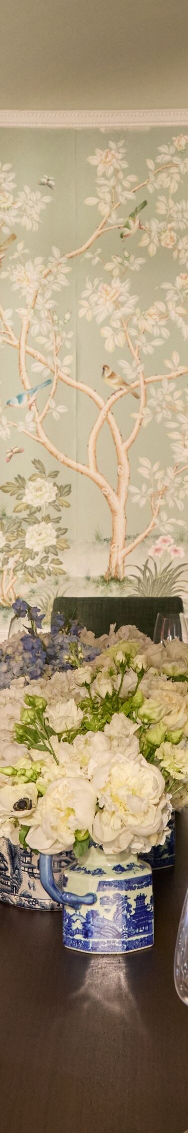 Elegant dining room with mural and flowers