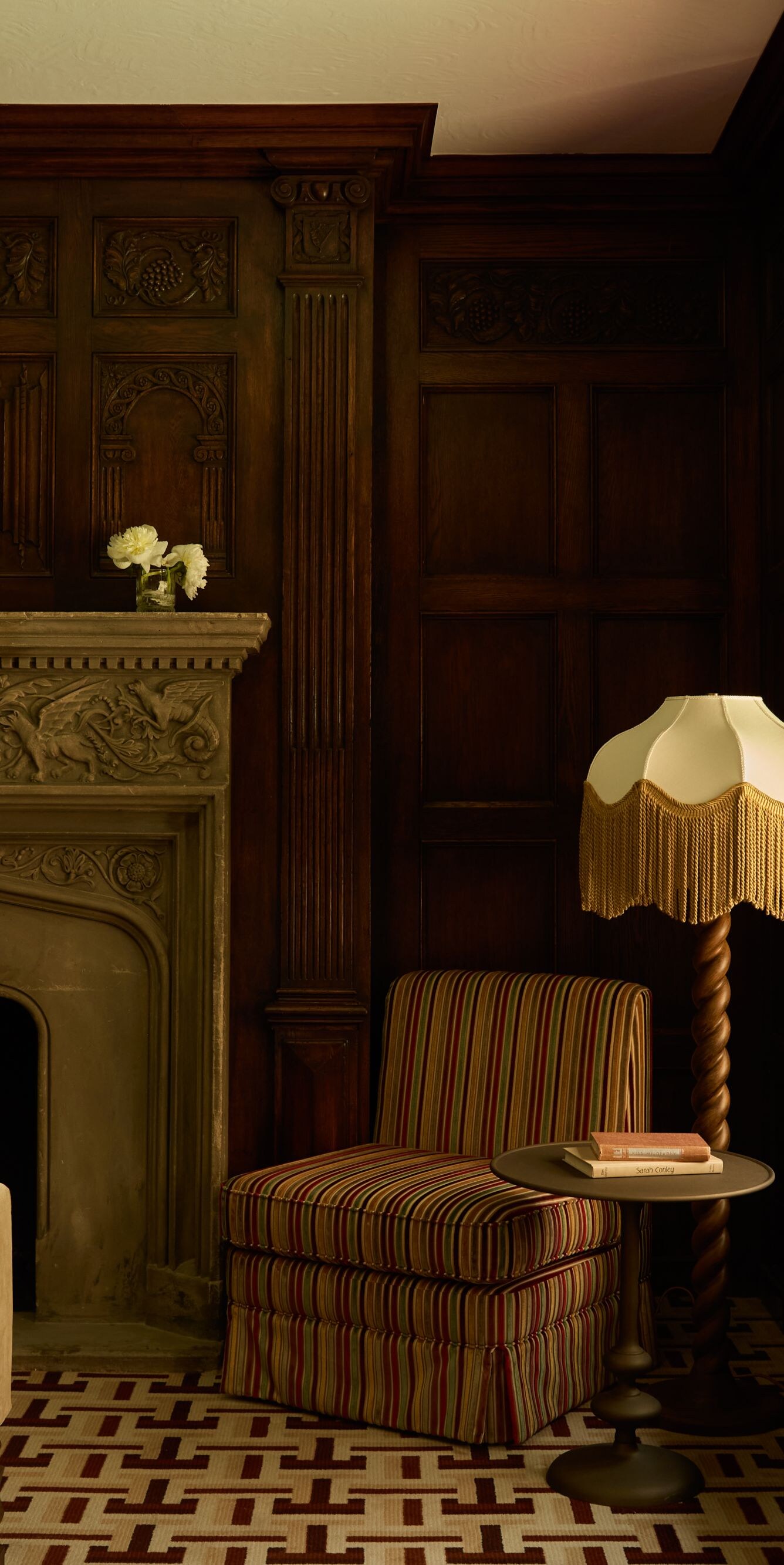 Suite sitting area with fireplace and window seat