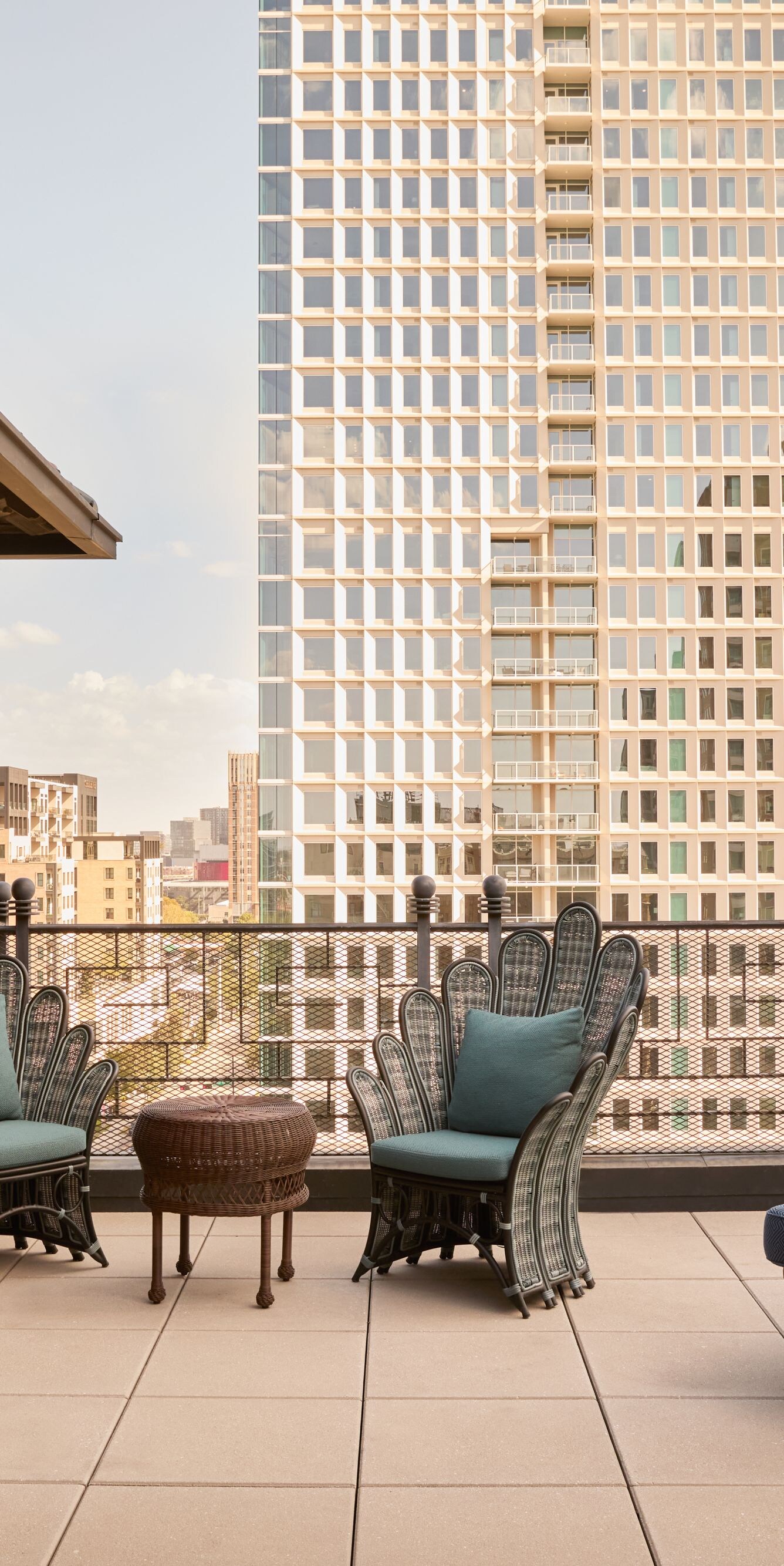 Rooftop terrace with seating and city views