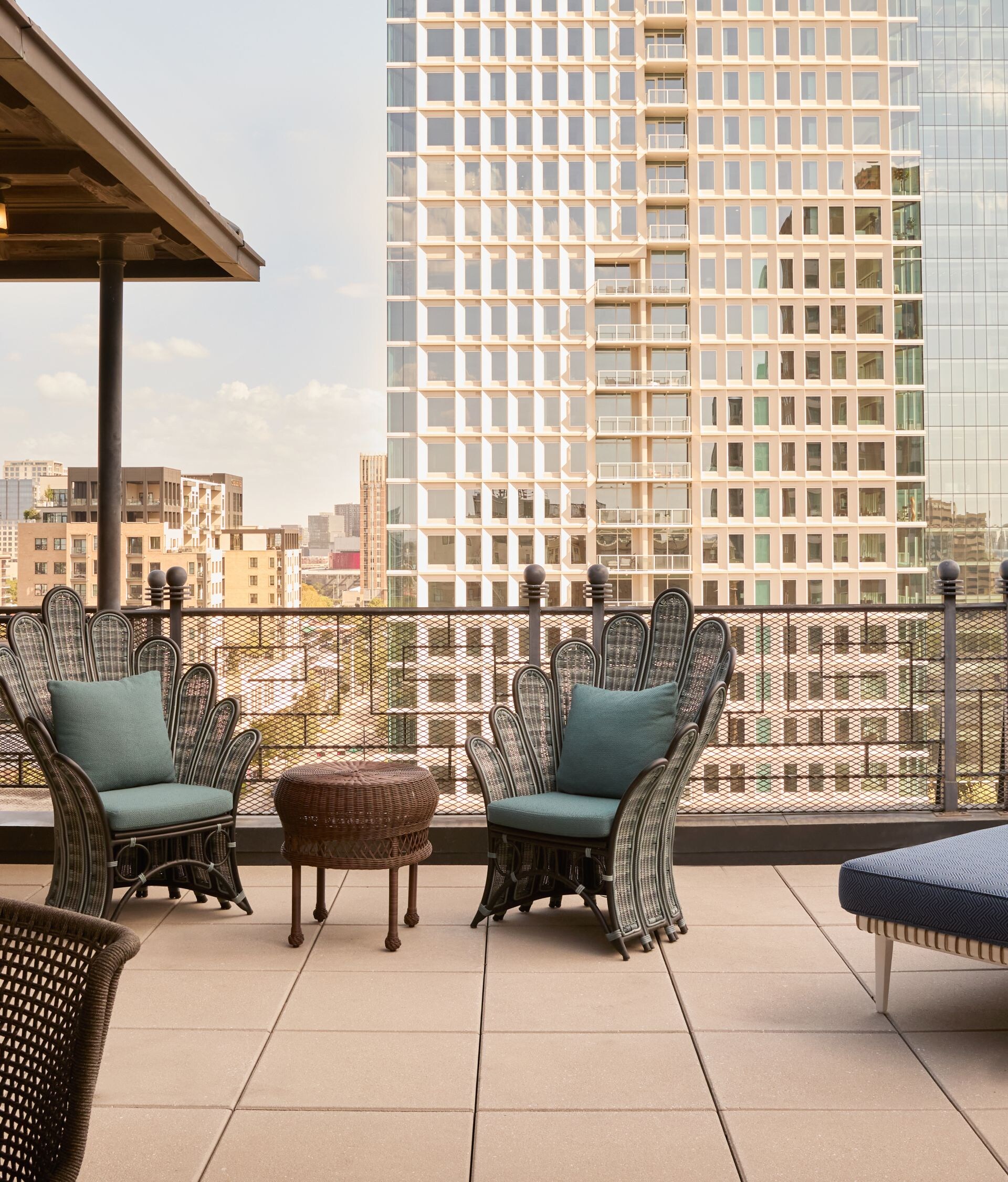 Rooftop terrace with seating and city views