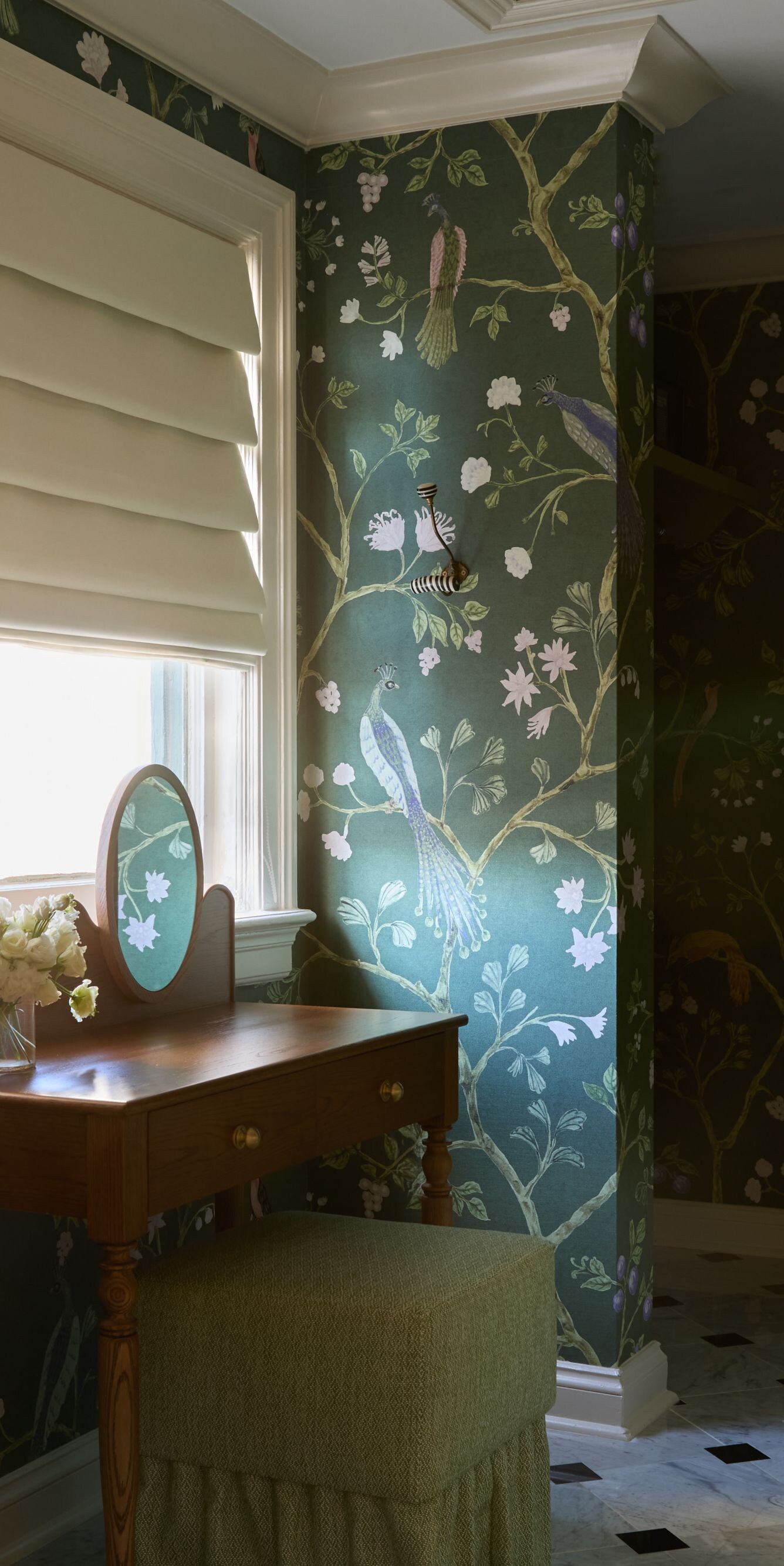 Vanity table with floral wallpaper and mirror
