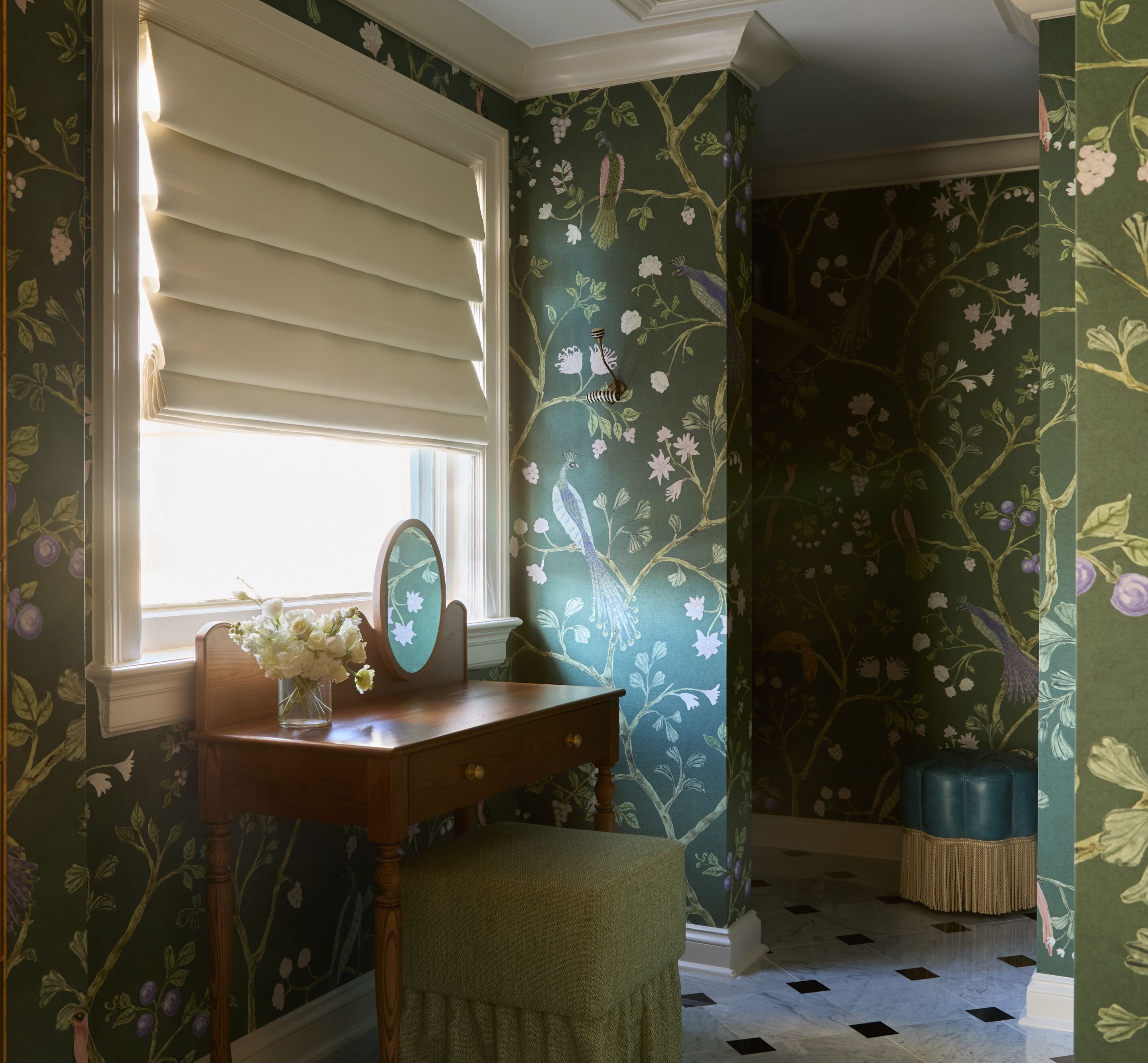 Vanity table with floral wallpaper and mirror