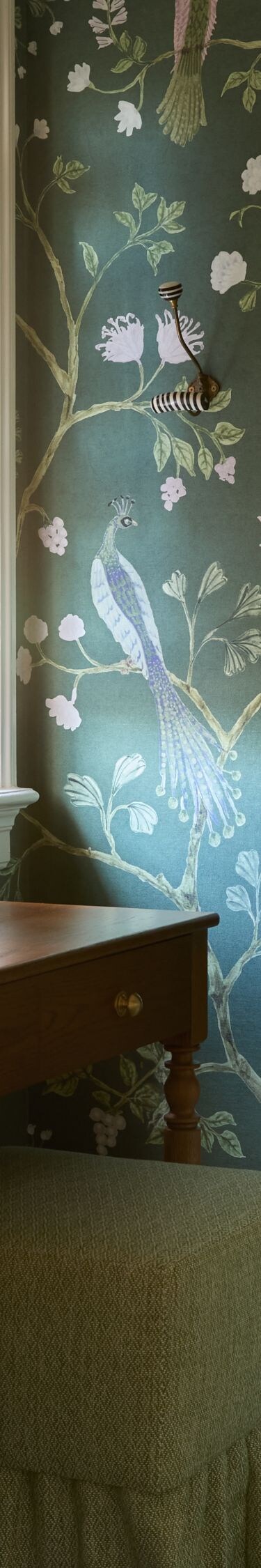 Vanity table with floral wallpaper and mirror