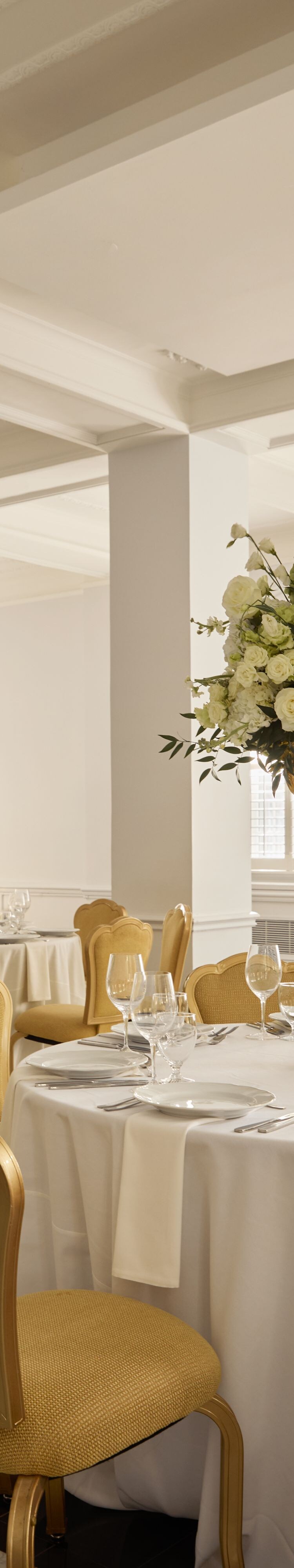 Wedding reception tables with floral centerpieces