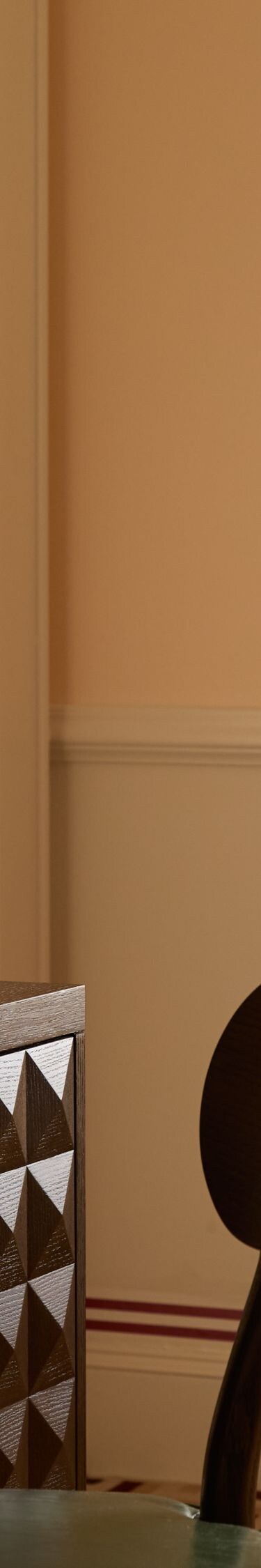 Desk and chair beside window in guest room