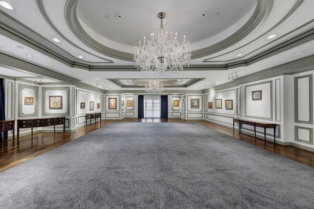 Large room with artwork and chandelier