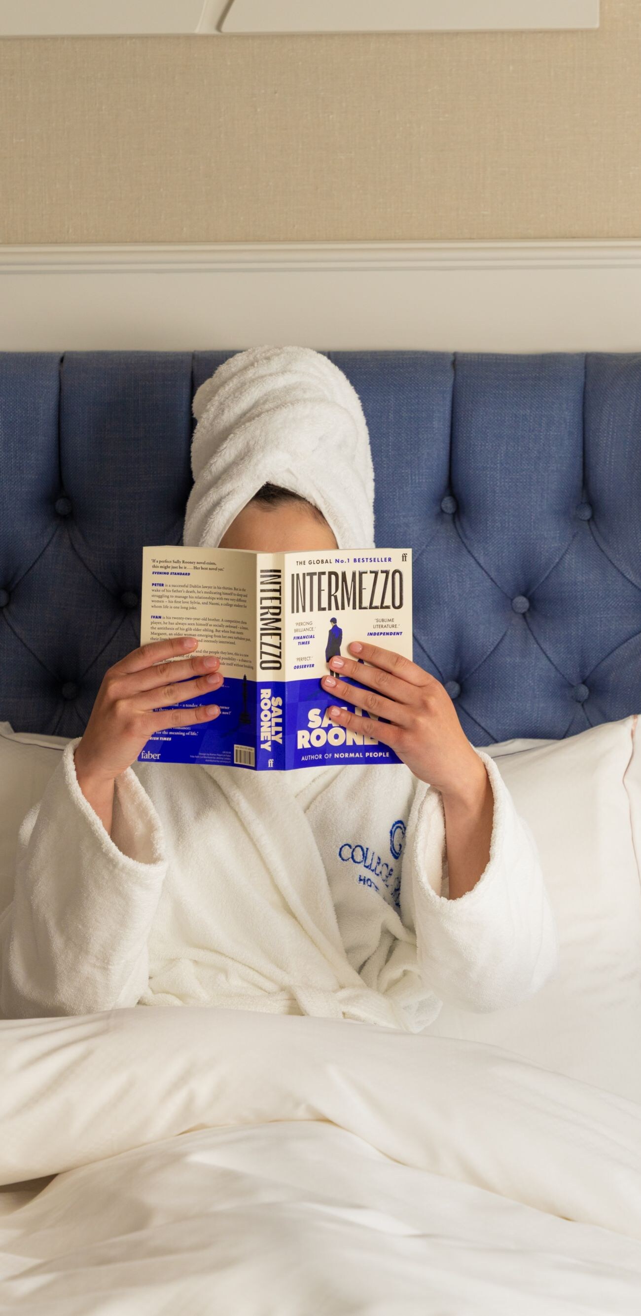 woman reading book in room