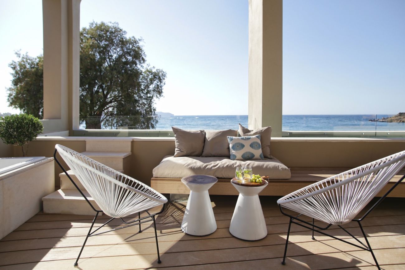terrace with sofa table and chairs and sea view