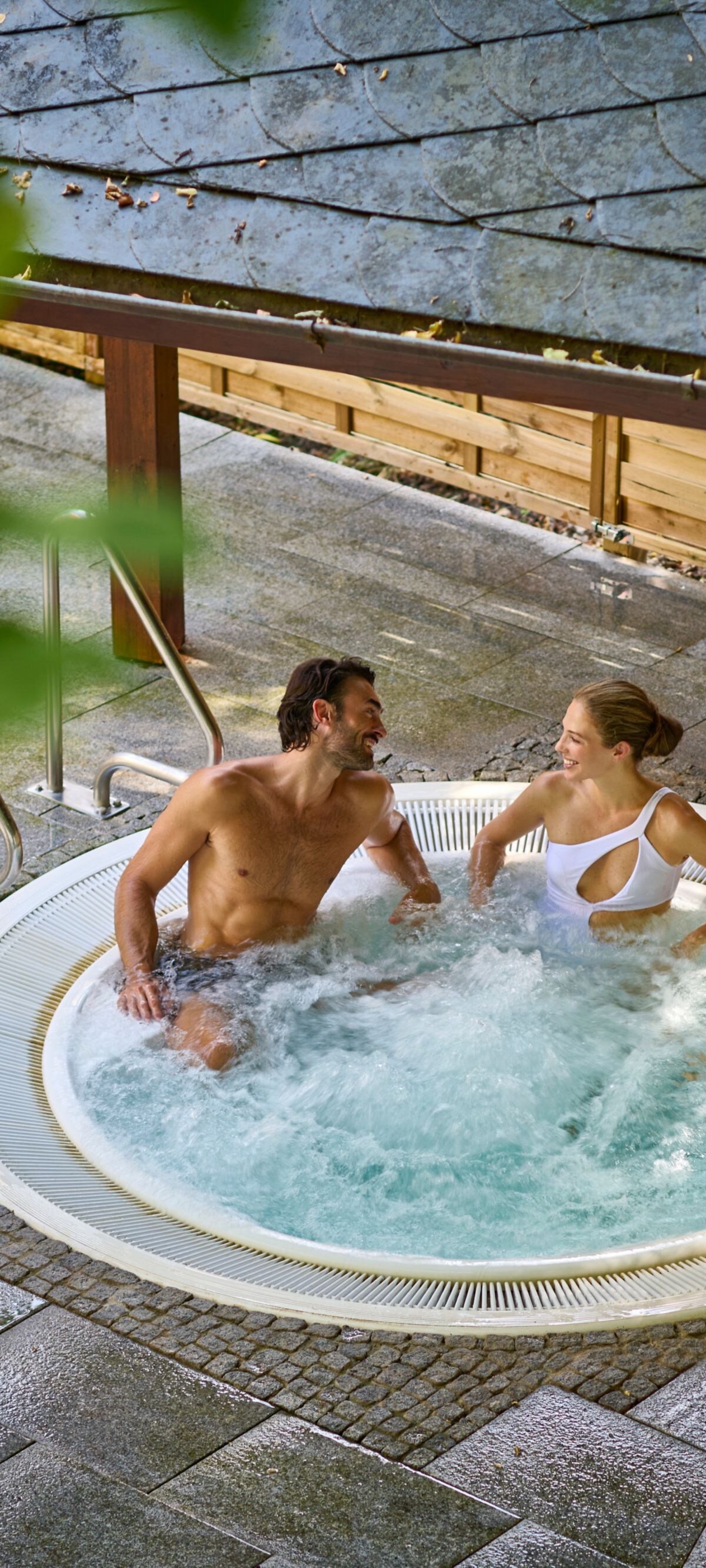 Couple using the outdoor whirl pool