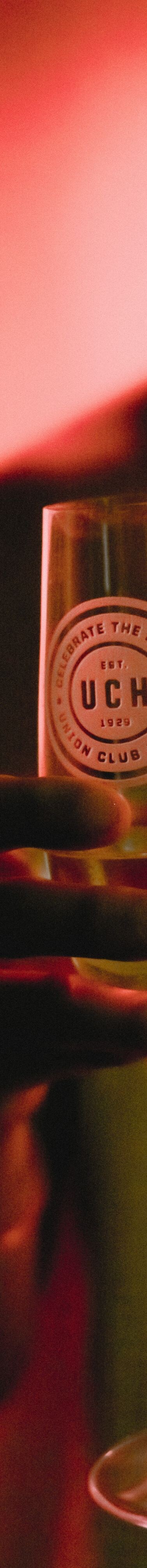 A guest holding a champagne glass in infrared spa
