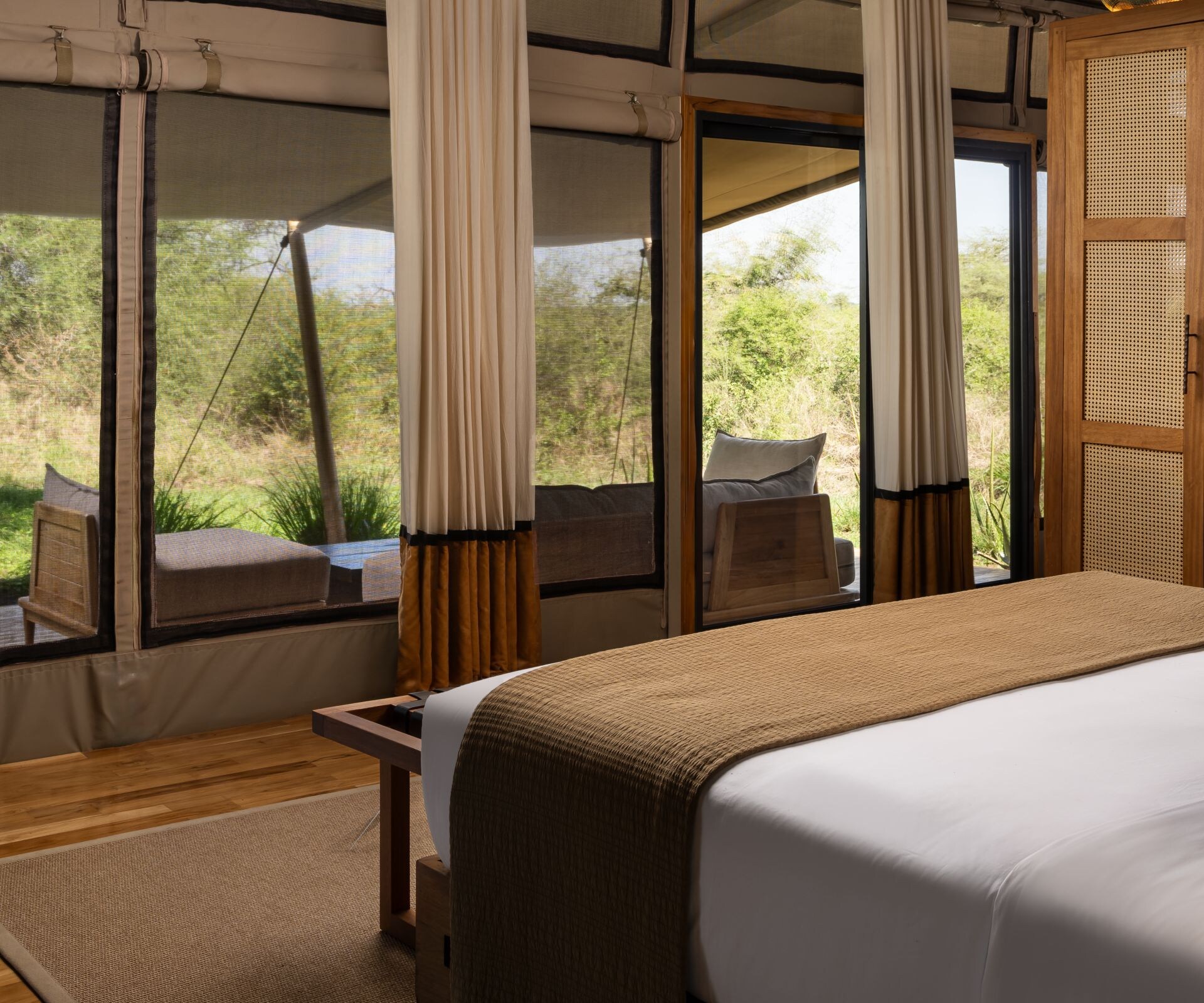 Twin bedroom with natural textures inside a luxury