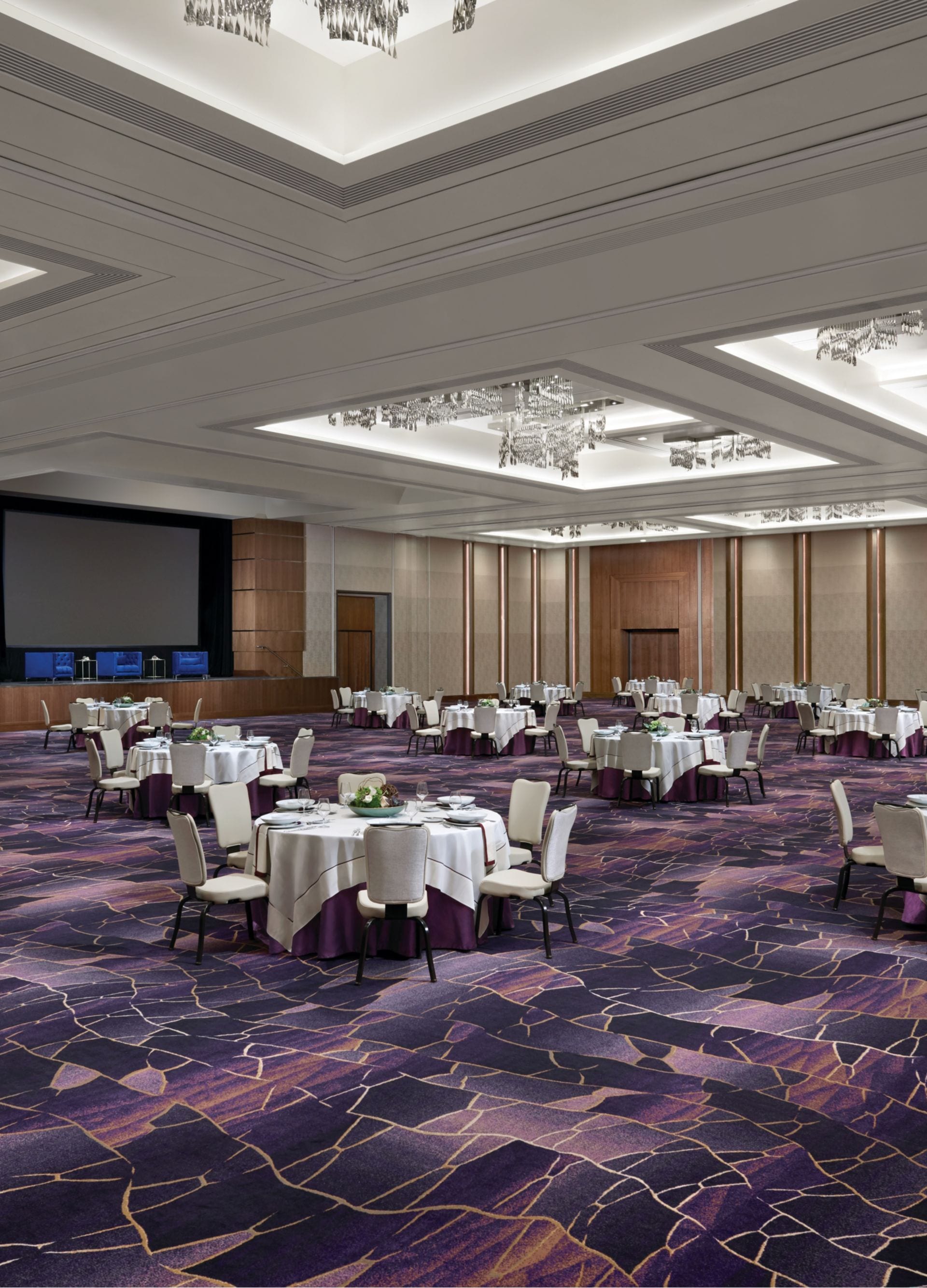 Meeting room set up with round tables and chairs