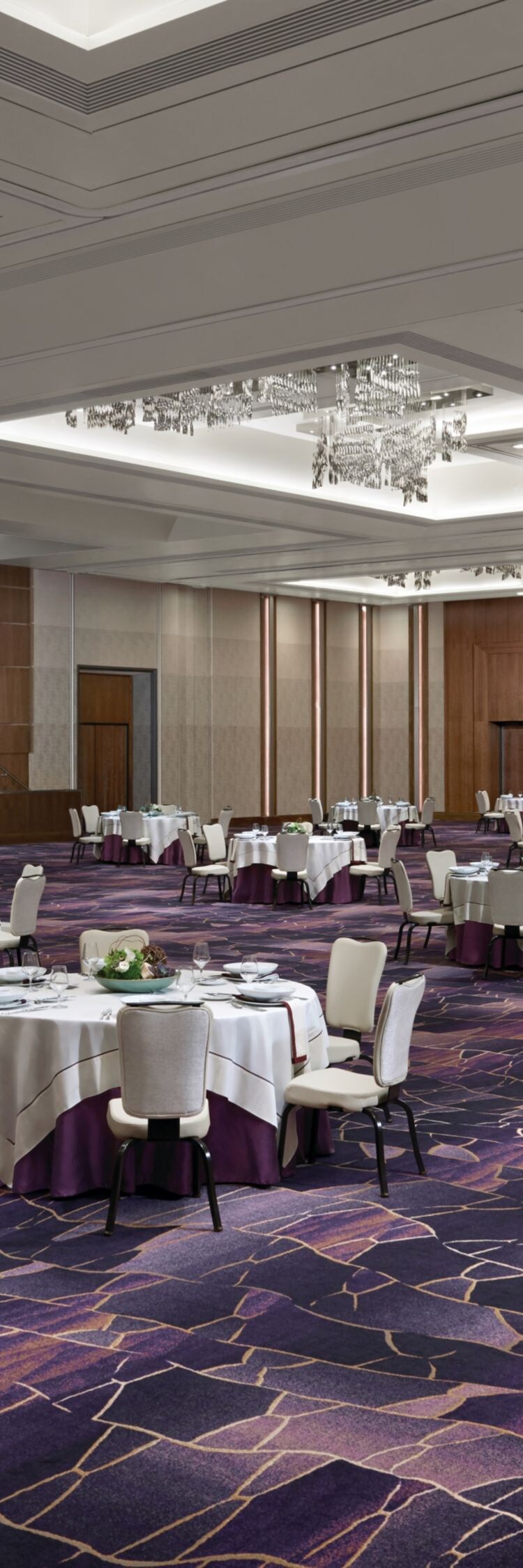 Meeting room set up with round tables and chairs