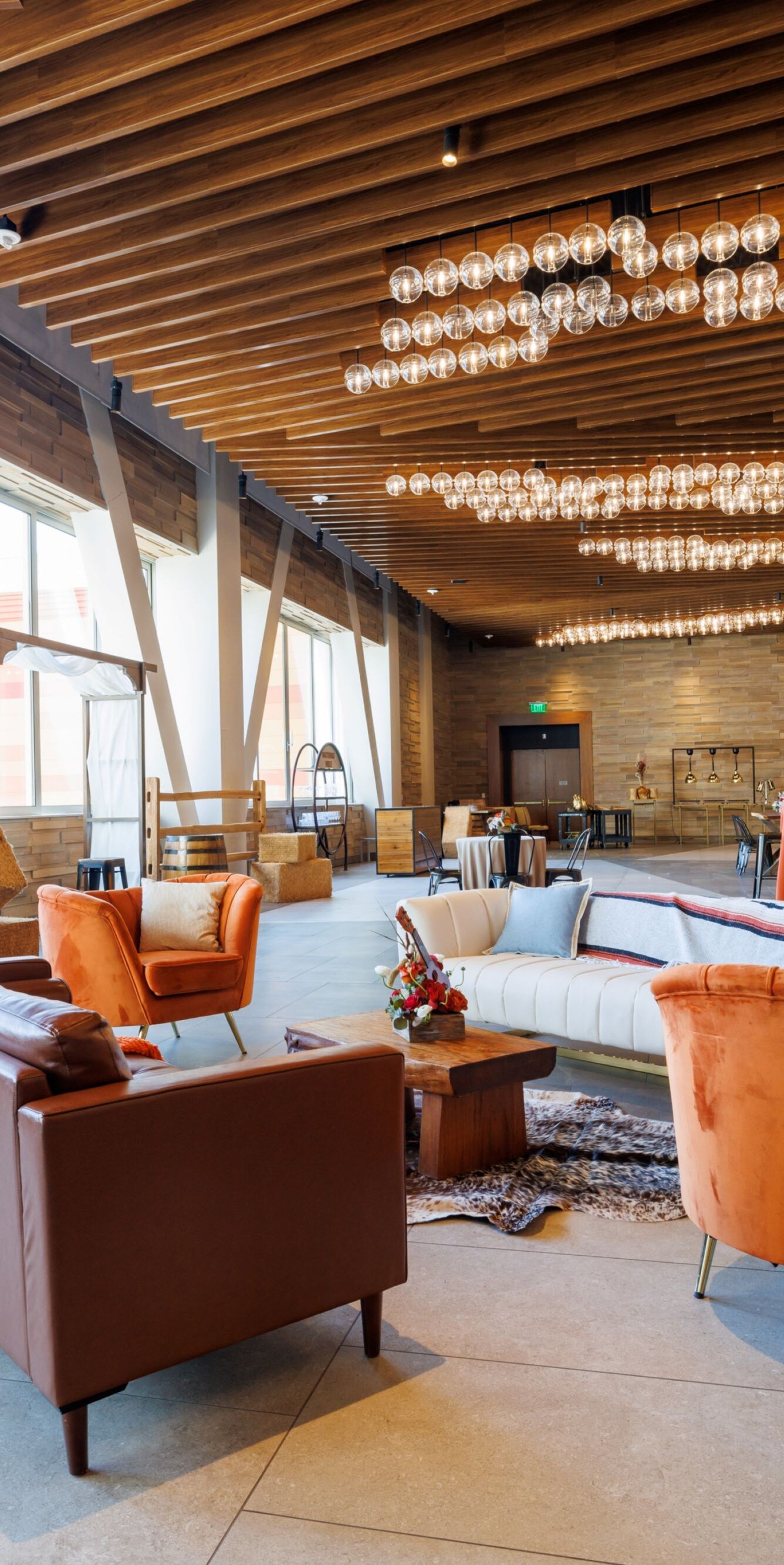 Chairs, sofas, end tables in meeting facility.