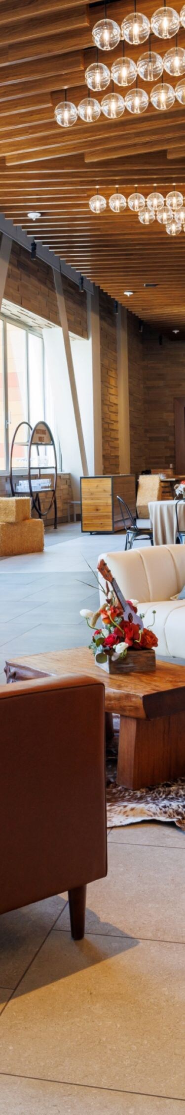 Chairs, sofas, end tables in meeting facility.