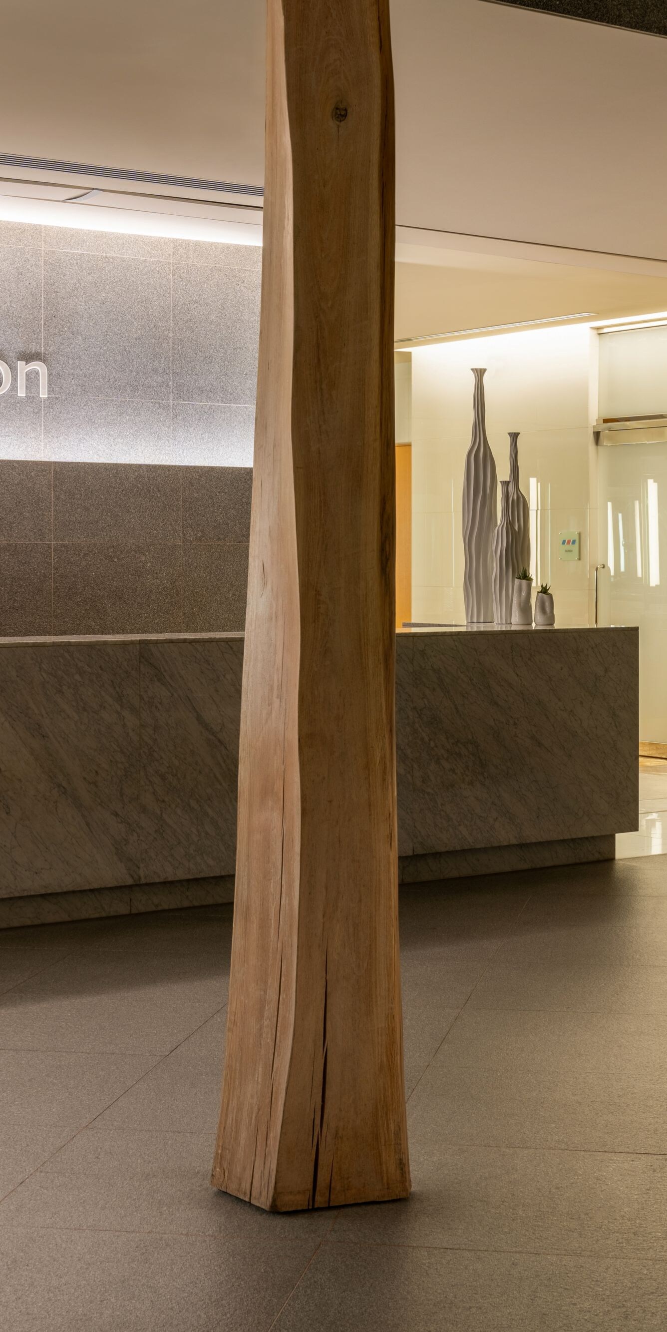 Wood pilars, reception desk, salon sign