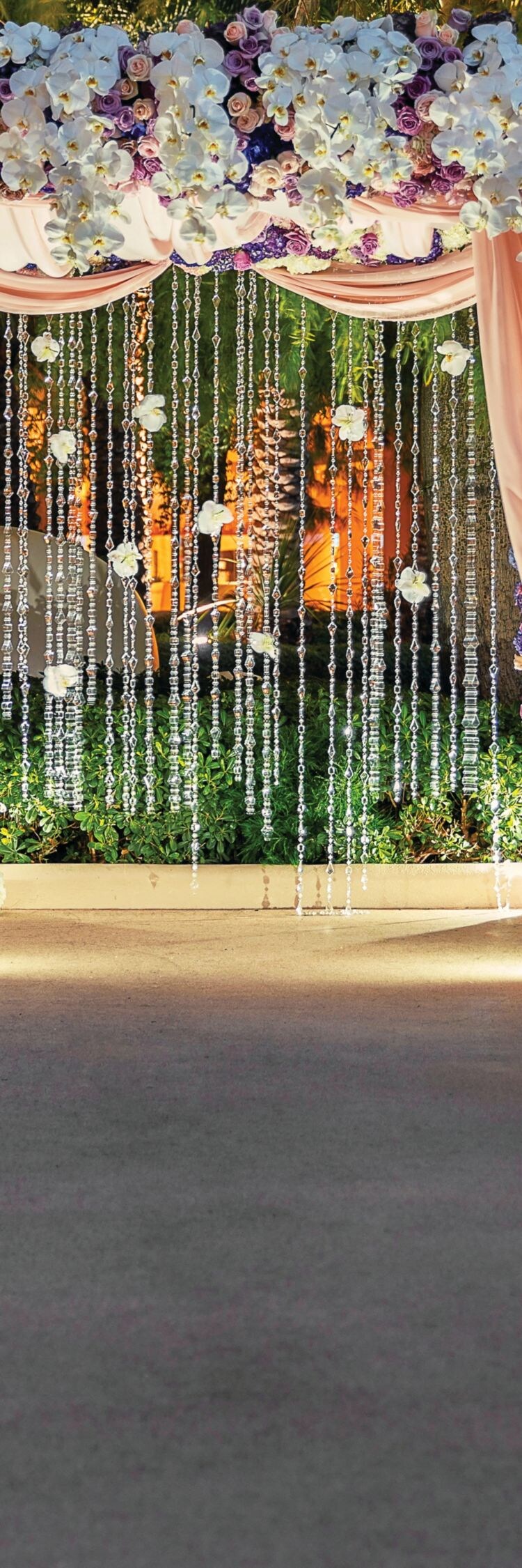 Flower archway, chairs, pillars.