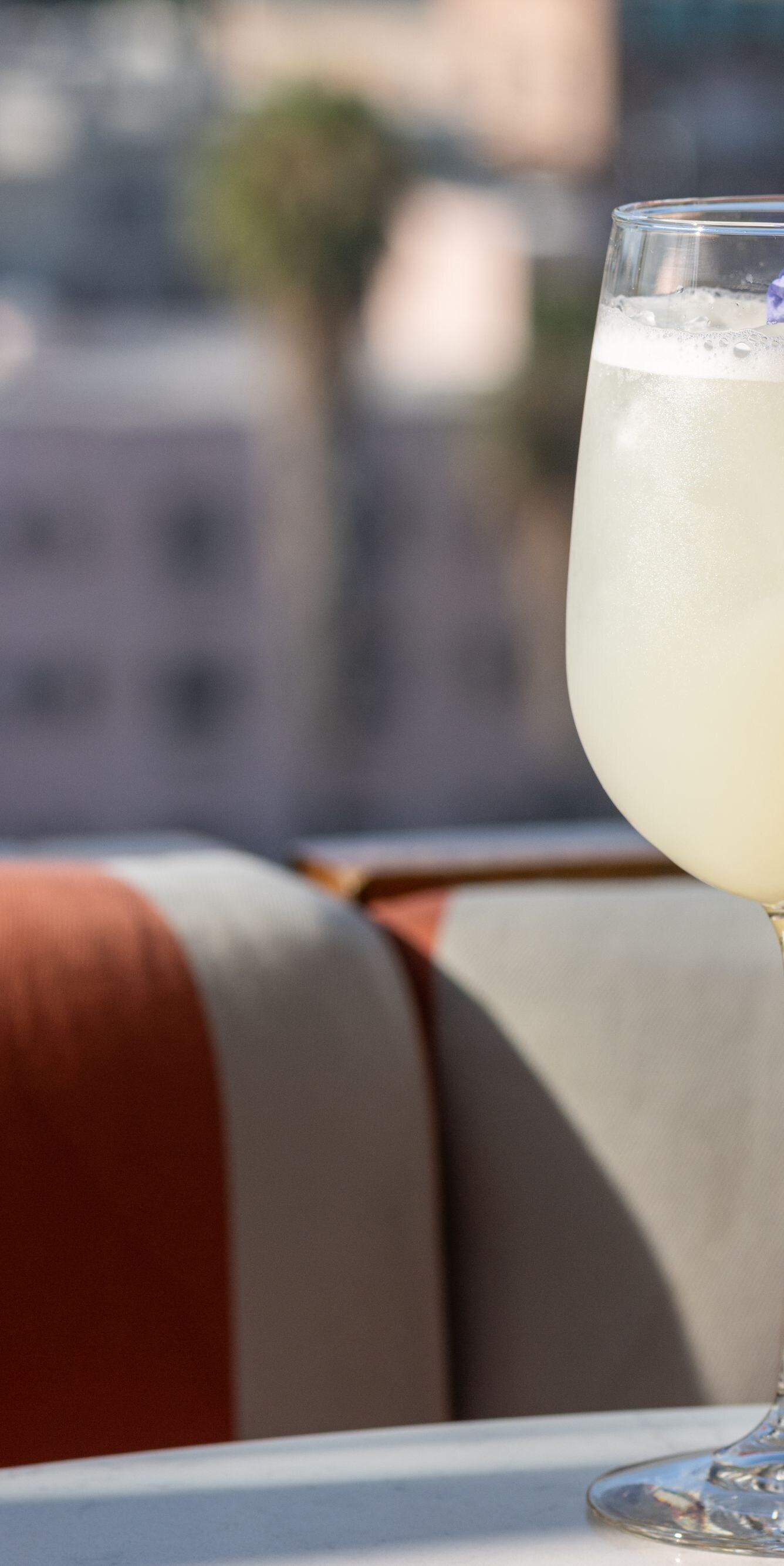 Light spritz cocktail with city view