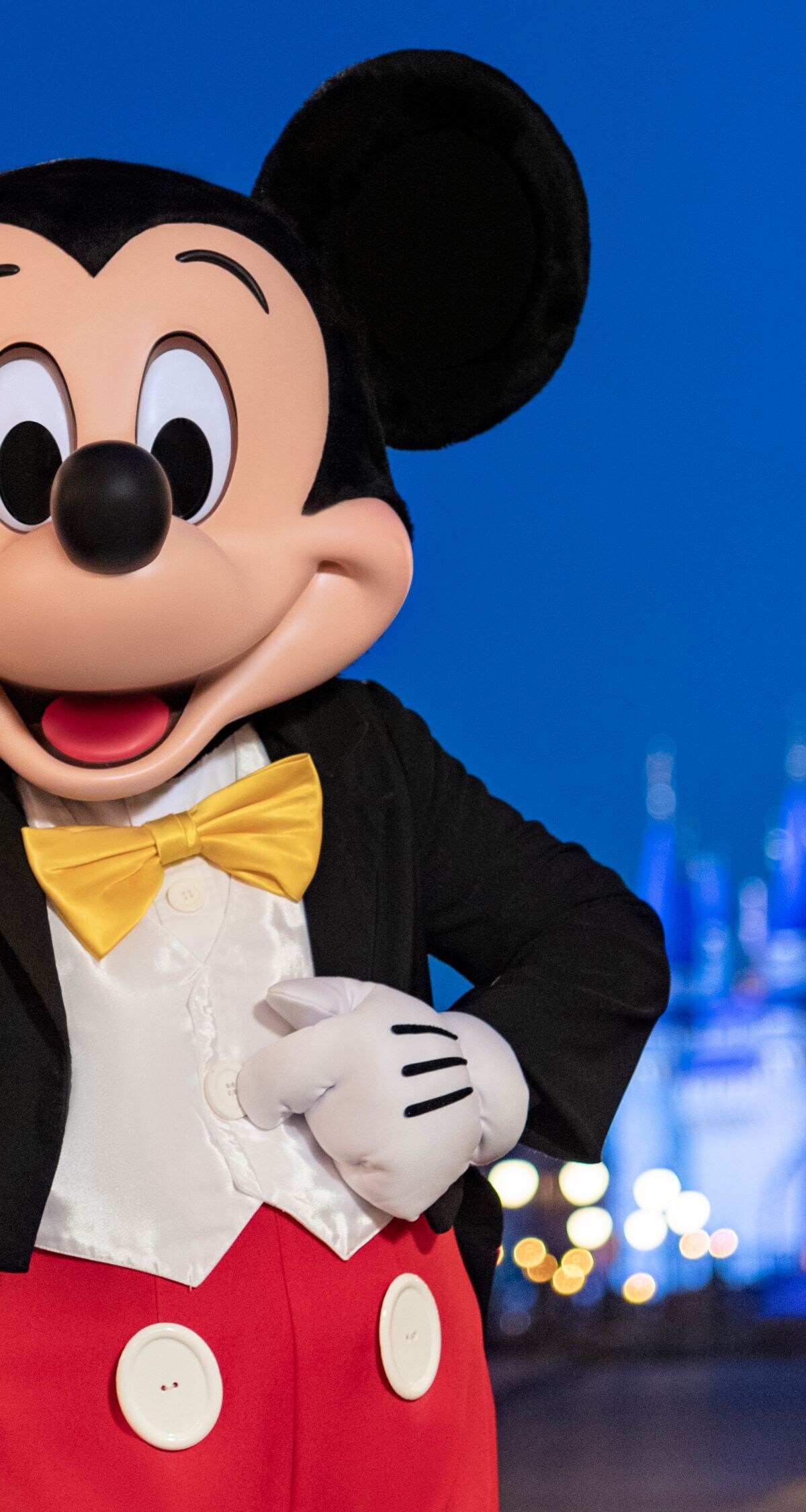 Mickey Mouse on Main Street with castle backdrop
