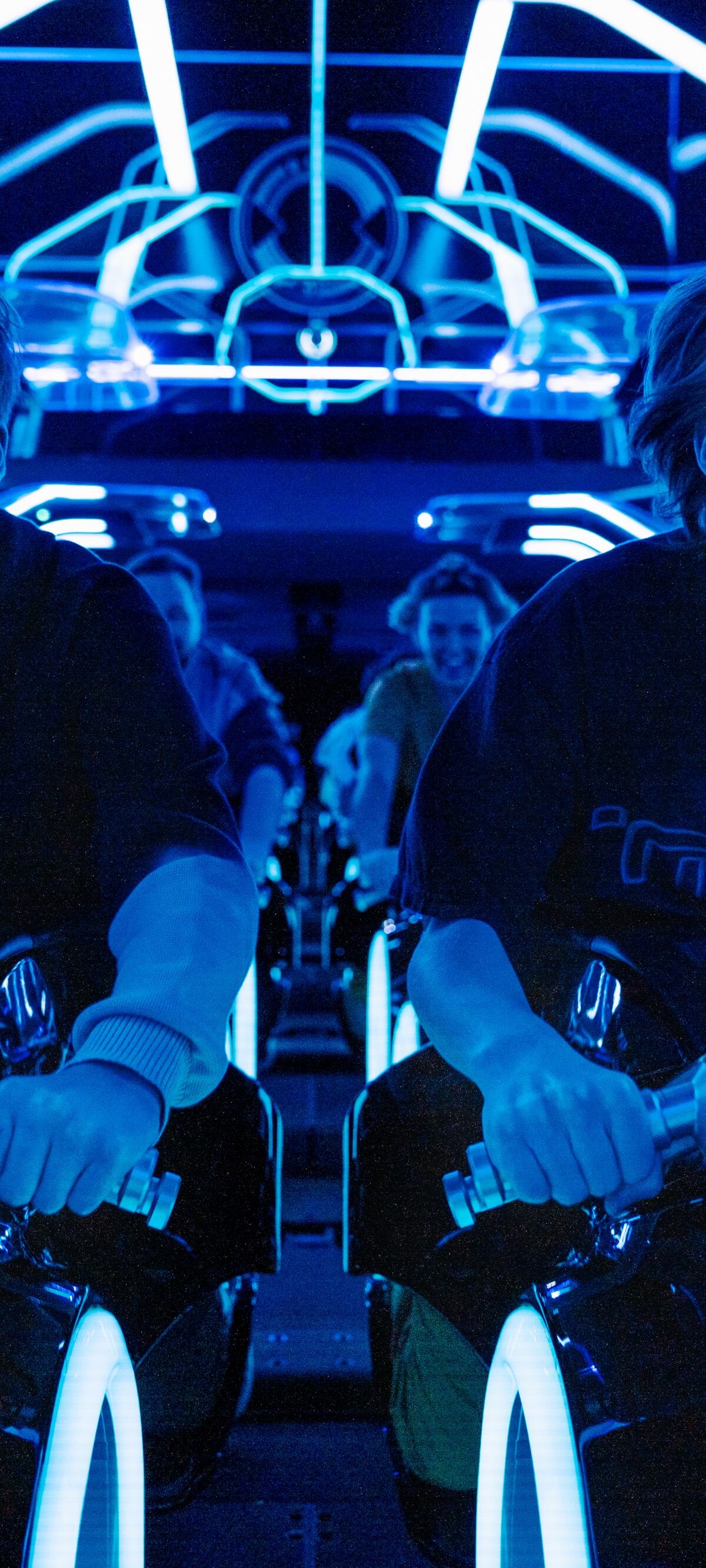 Picture of two boys on a motorcycle ride at Disney