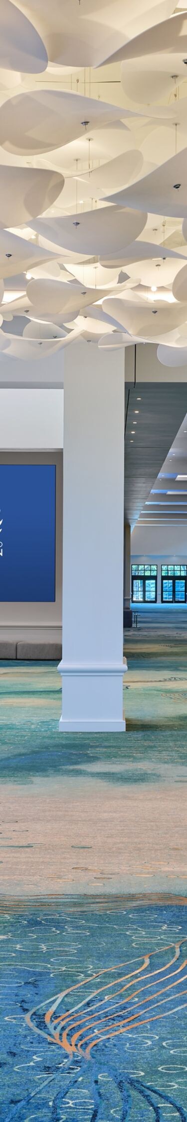 Peninsula prefunction space with ceiling sculpture