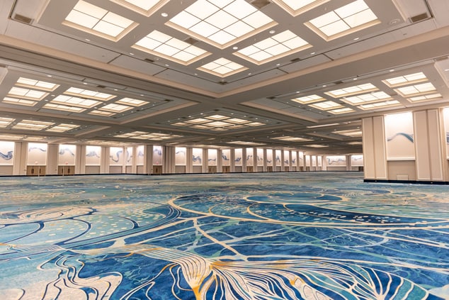 Large empty ballroom space with tall ceilings