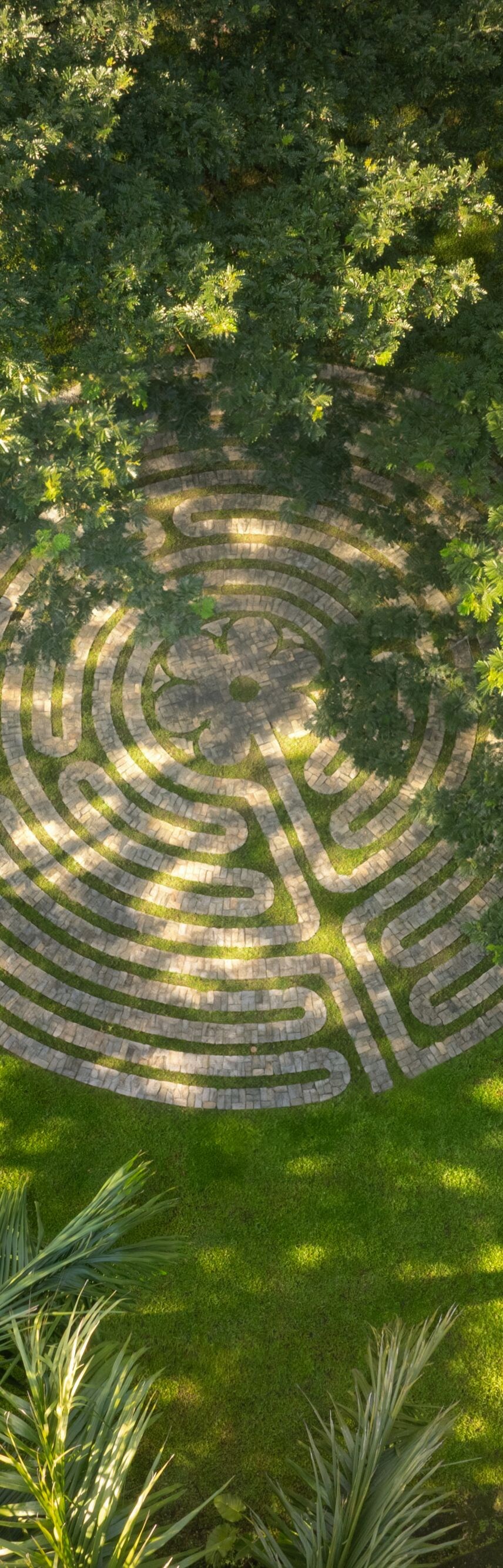 Walking labyrinth within lush gardens
