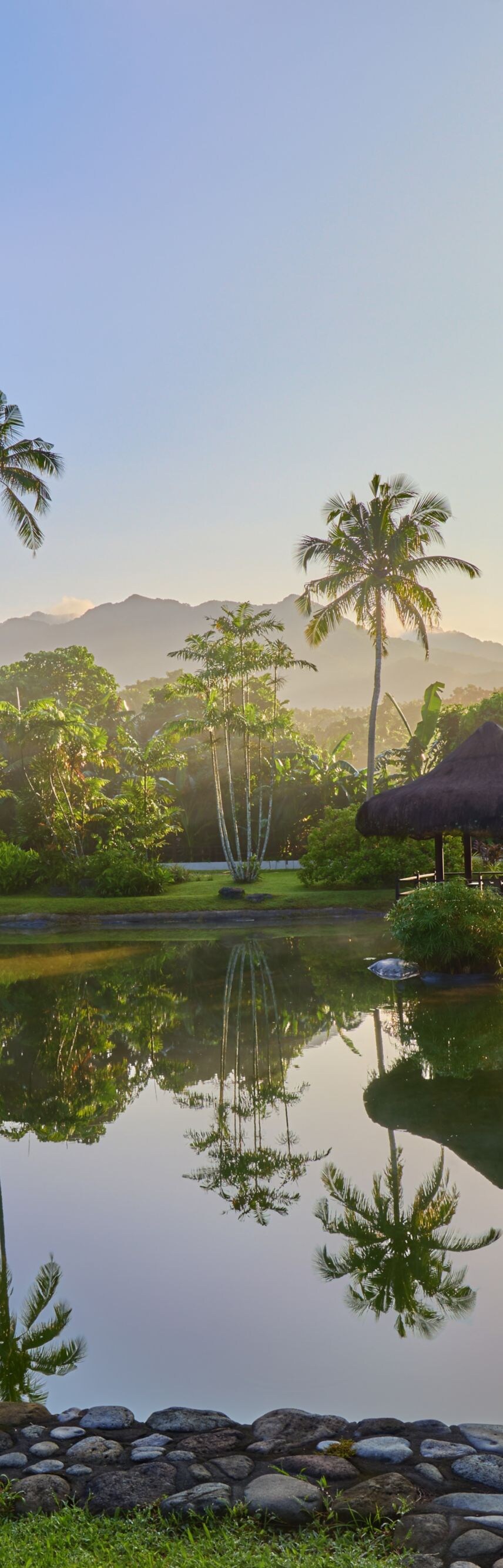 Serene lagoon framed by tropical greenery