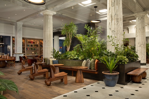 Lobby with seating and lush plant life
