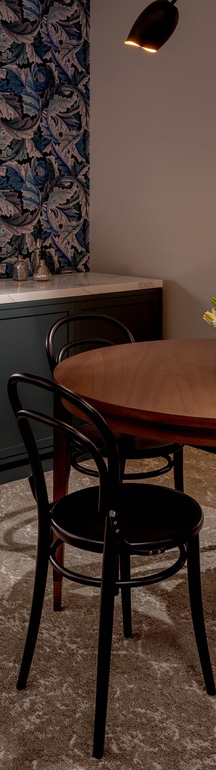 Round dining table and chairs inside a suite