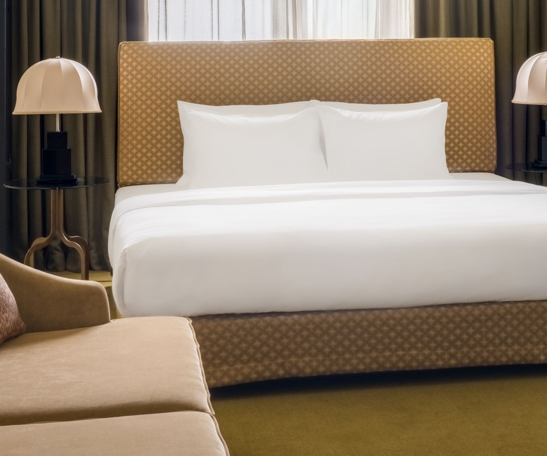 Bedroom with king bed, sofa and table seating