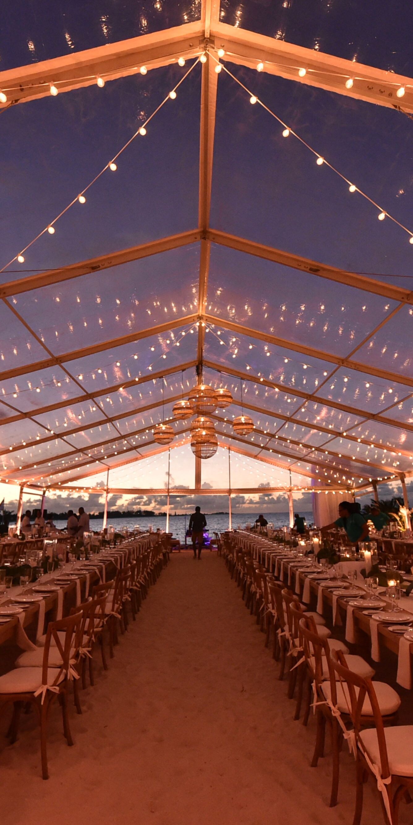 Long Banquet Setup Beneath String Lights