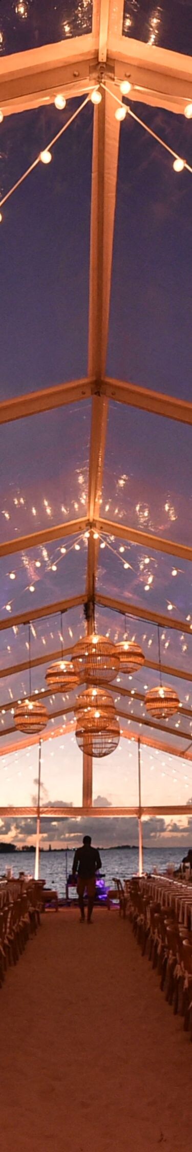 Long Banquet Setup Beneath String Lights