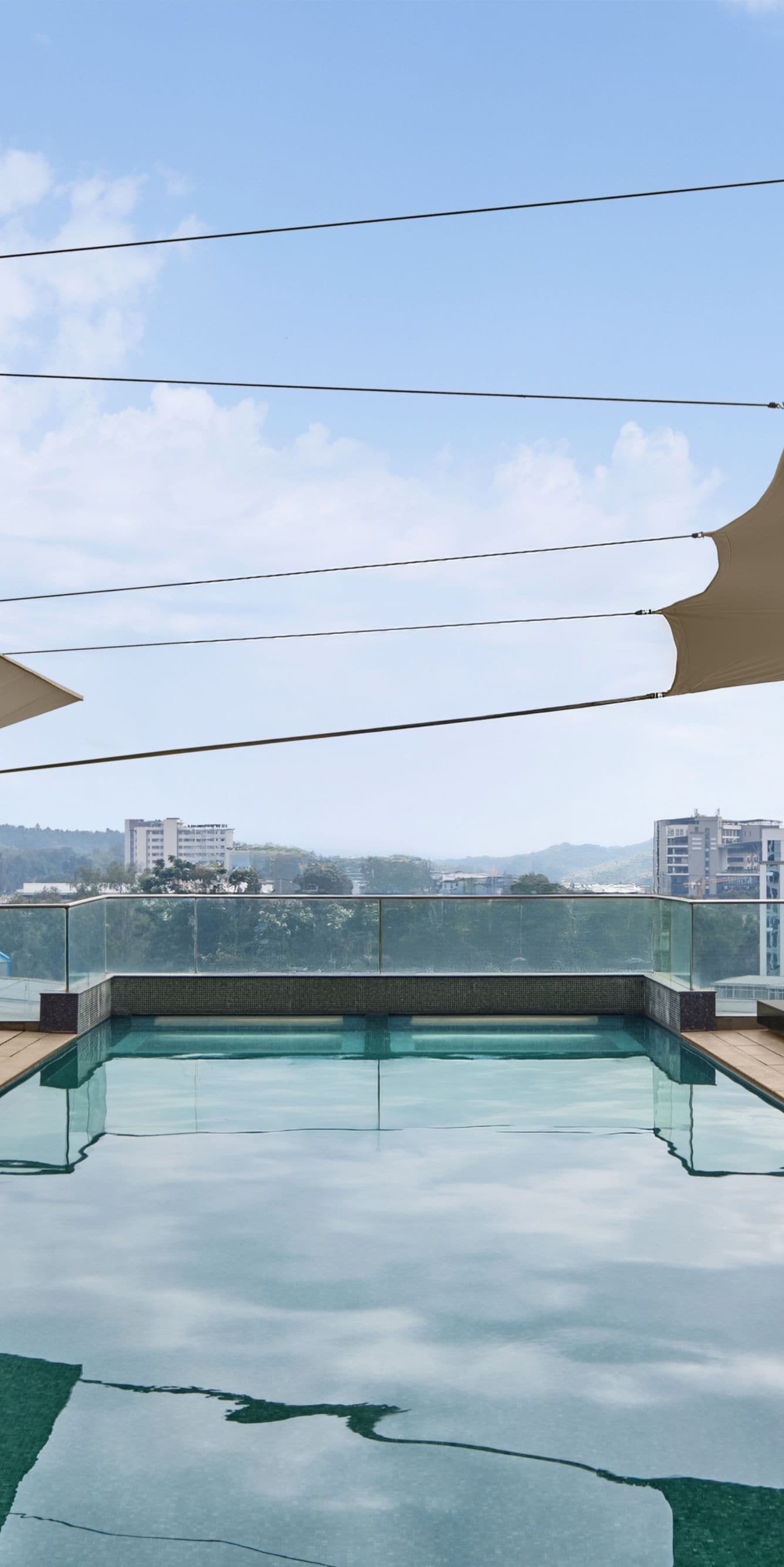Rooftop Pool with a city view in 