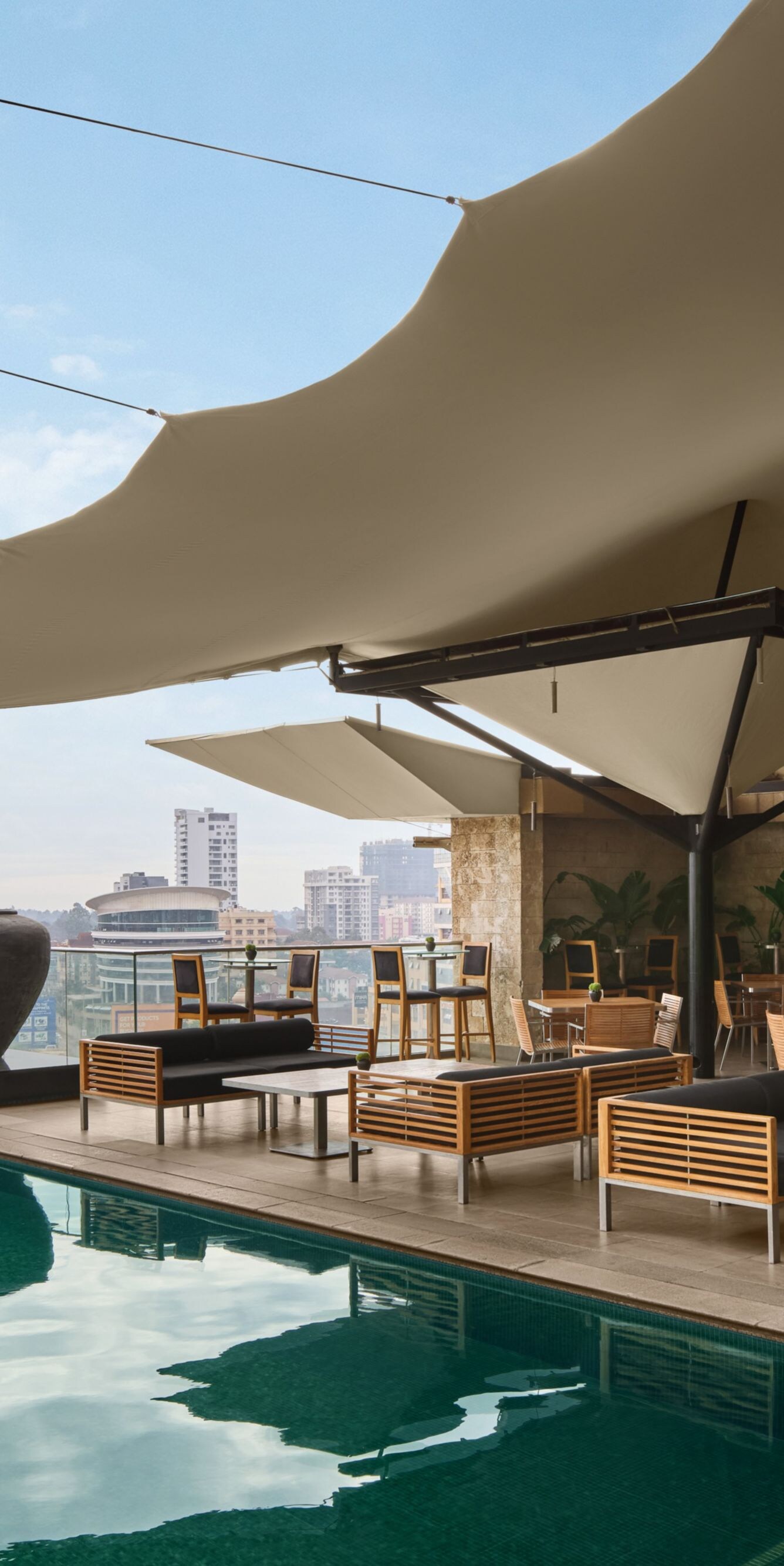 Seating area with the pool and city view