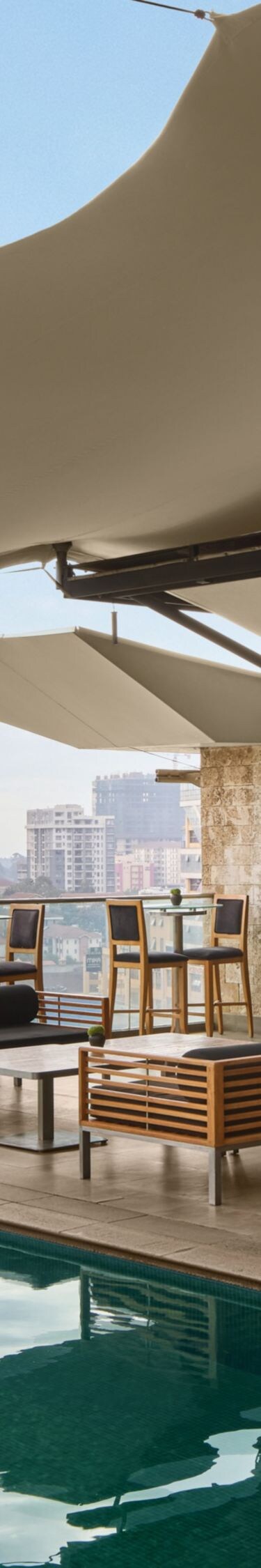 Seating area with the pool and city view