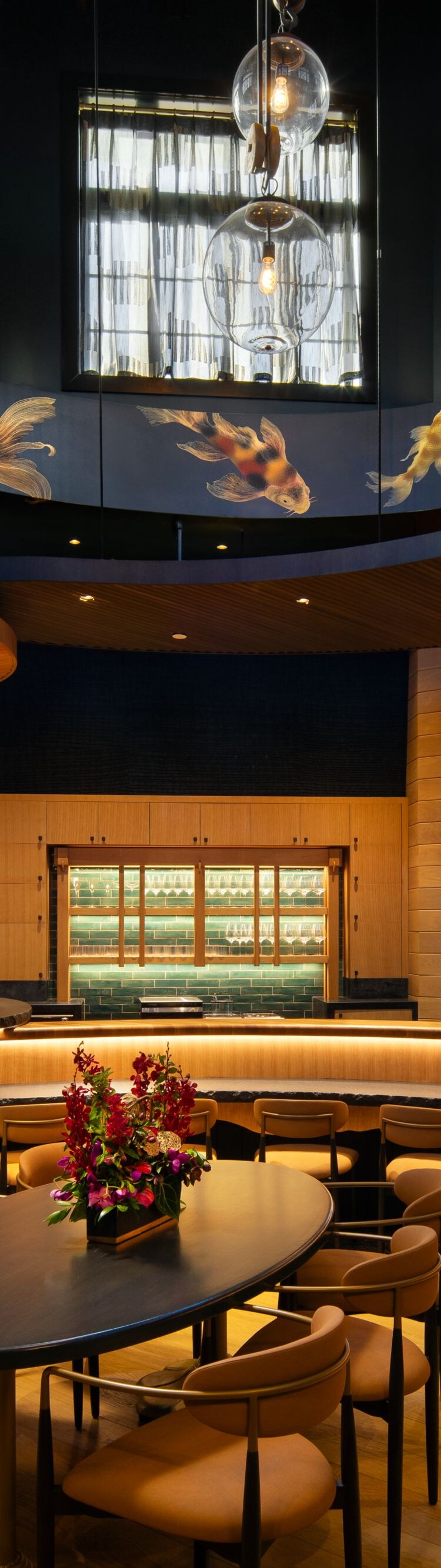 Modern bar with curved counter and koi art