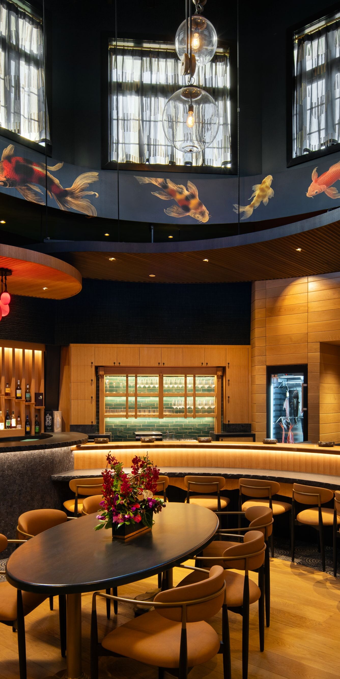 Restaurant interior with curved bar and art