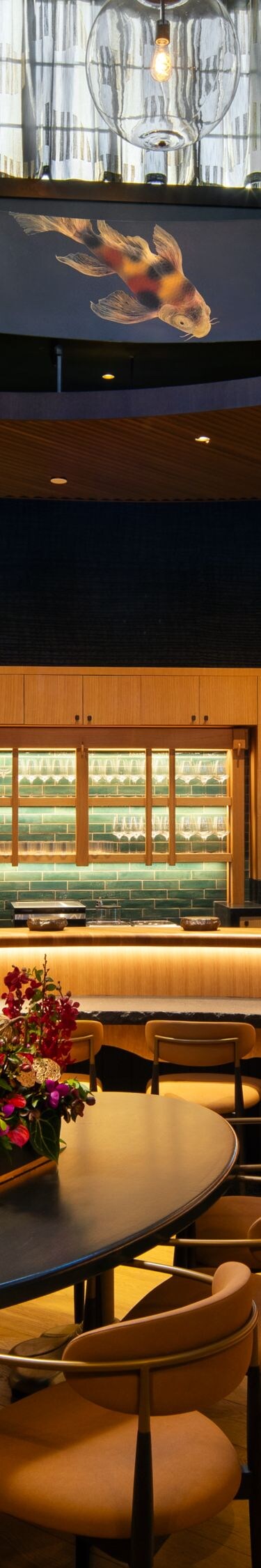 Restaurant interior with curved bar and art