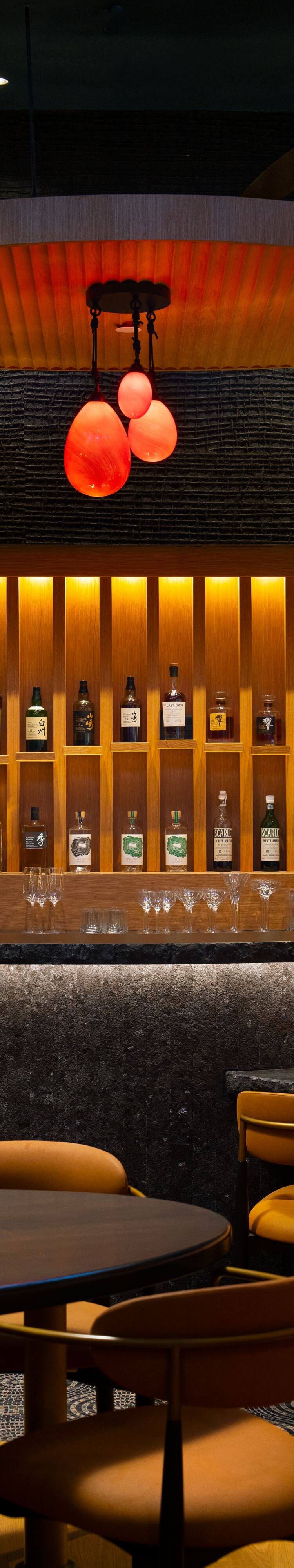 Modern bar with gold lighting and spirits