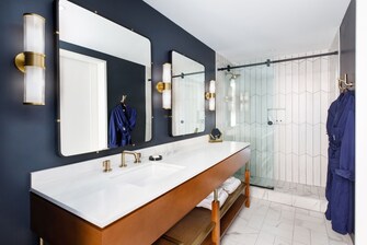 With touches of gold and sapphire, the bathrooms f