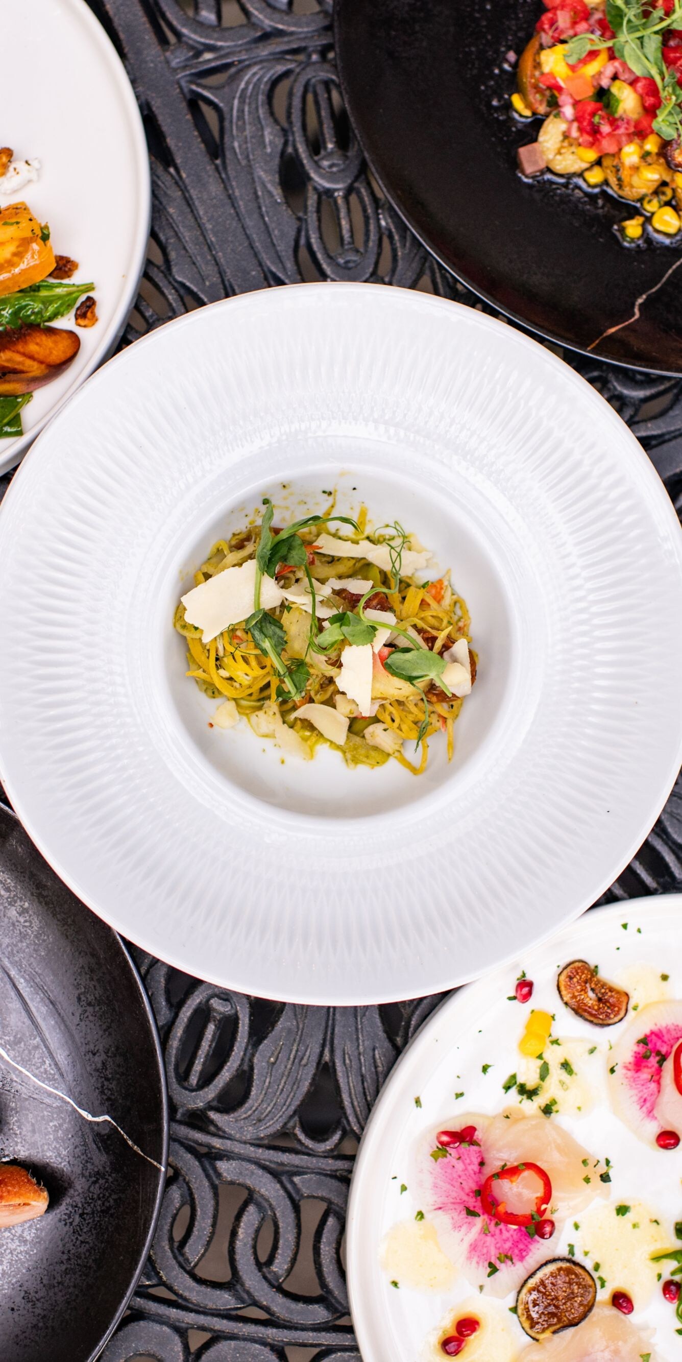 Multiple colorful dinner dishes