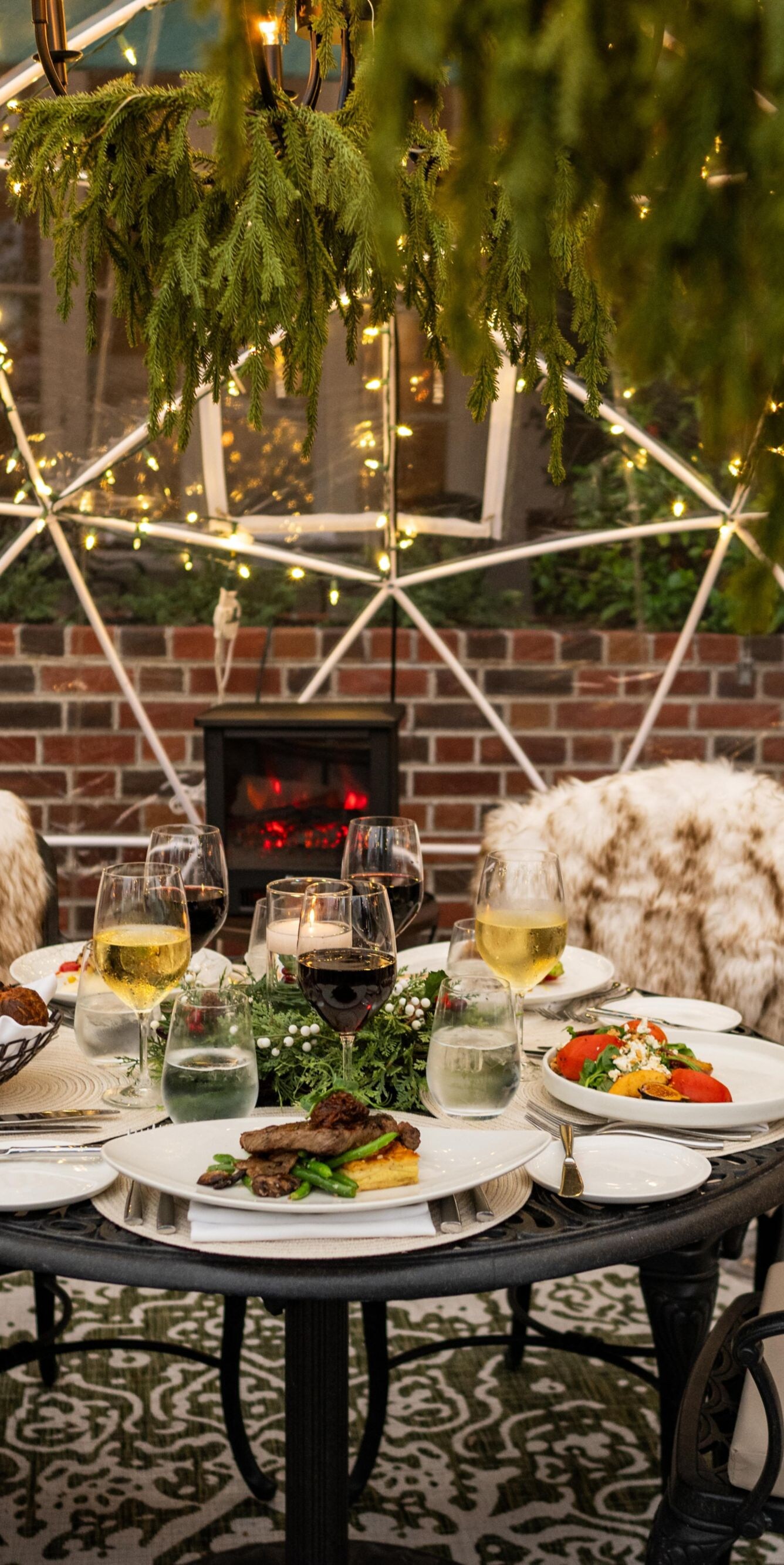 Cozy igloo dining with wine and food