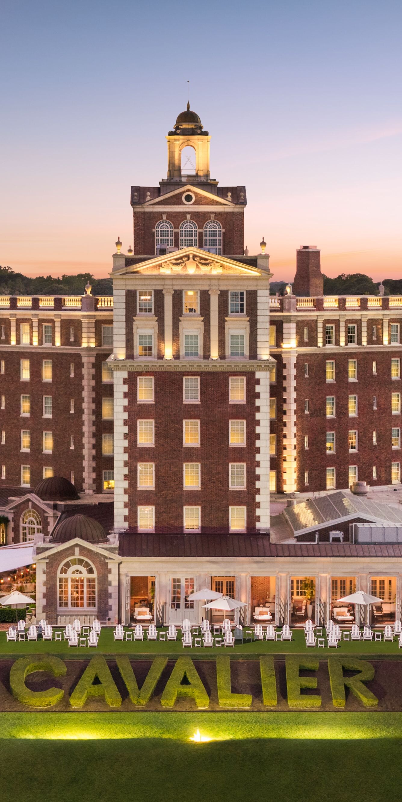 Historic resort exterior at sunset