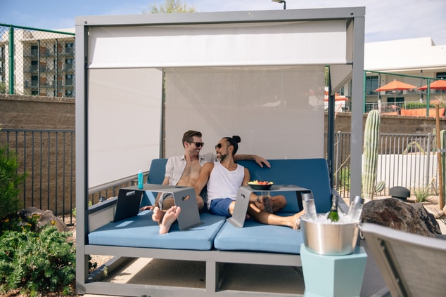 Couple relaxing in shaded cabana