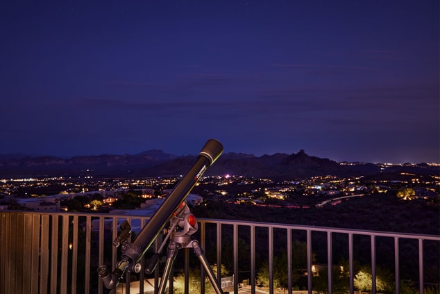 Patio with telescope evening sky